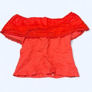 red yoshiko button-back top with lace ruffle detailing